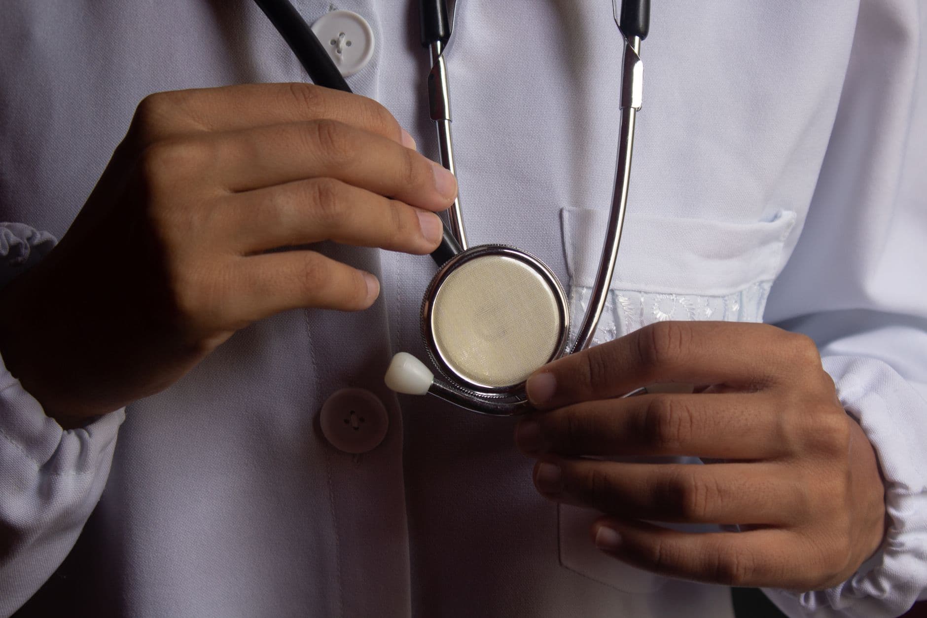 A close-up of a doctor holding a stethoscope